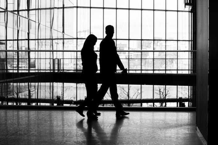 Silhouette image of corporate people walking